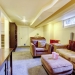 26301218 - carpet floor living room with sofa and chair. furnished with bookshelf, cabinet and tv