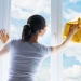 young woman washing windows