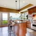 13888935 - luxury kitchen interior with green walls and stone floor and water view.