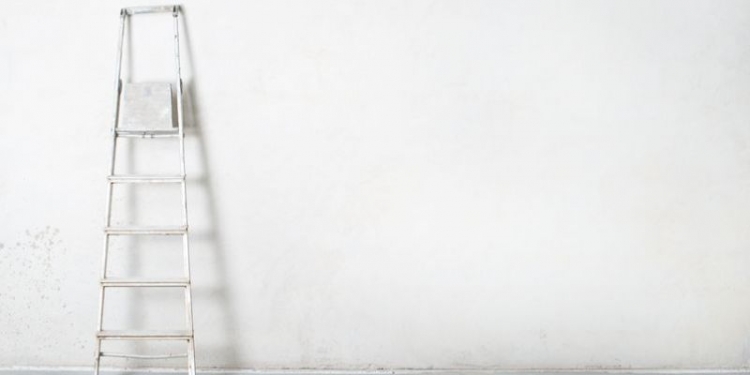 20413371 - ladder on concrete wall, construction site.