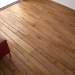 30533035 - wooden floor texture with red leather couch and pillow