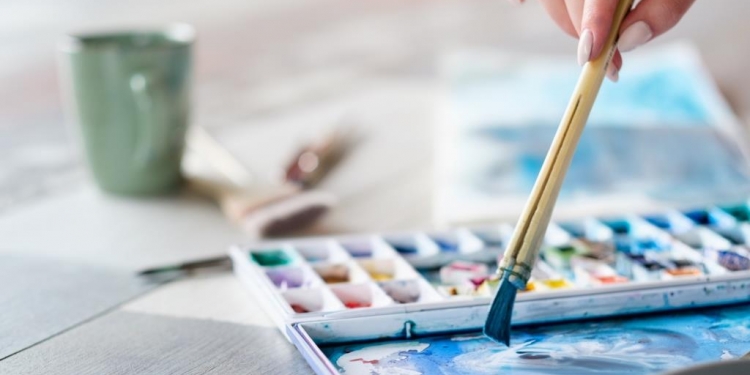 art painting hobby. creative leisure. artist mixing watercolors preparing to draw picture. talent inspiration creation and self expression concept.